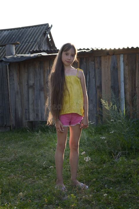 Teen Girl with Long Hair in Countryside Yard, Russian Village Stock ...