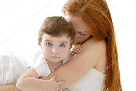 Baby and redhead mother hug on white Stock Photo by ©lunamarina 5513757