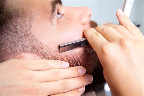 Man Having a Shave at the Barber Shop. Stock Photo - Image of chair ...
