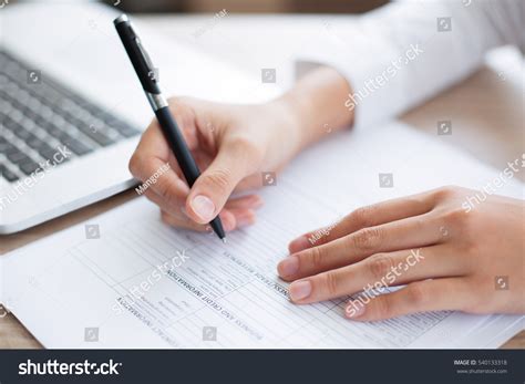 Closeup Business Person Completing Form Stock Photo (Edit Now) 540133318 
