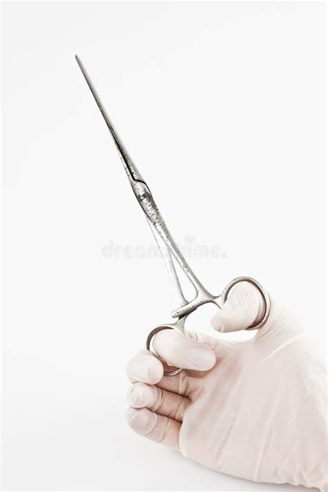 Hand with surgical tong stock photo. Image of procedure - 28306530
