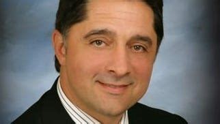 macomb  hires search firm  find finance director