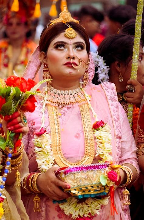 A Woman in Traditional Clothing Looking Up · Free Stock Photo