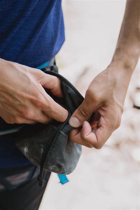 Unrecognizable Man Opening Leather Purse · Free Stock Photo