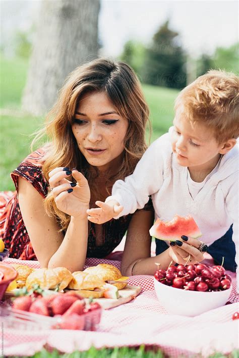 "Mother And Son At A Family Picnic In The Summer" by Stocksy