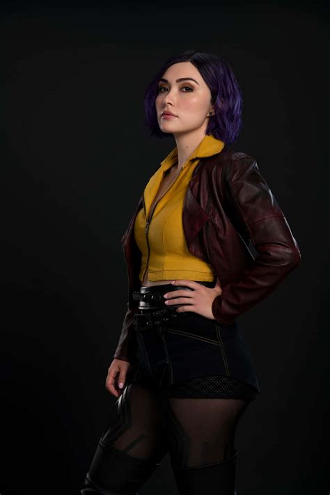 Download Faye Valentine striking a pose in front of a futuristic