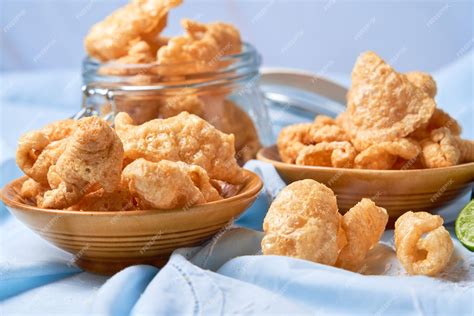 Premium Photo | Pork rinds also known as chicharon or chicharrones deep ...
