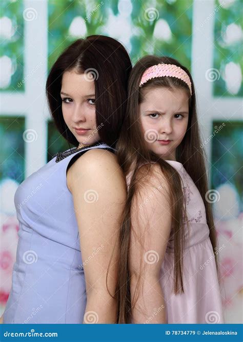 Older and younger sister stock image. Image of cute, adorable - 78734779