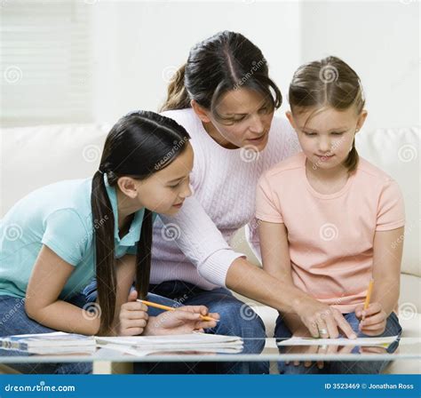 Mom Helping Kids with Homework Stock Image - Image of learn, mother