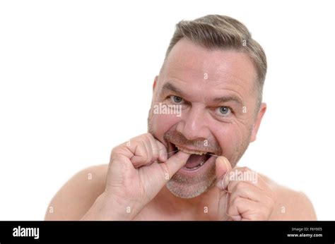man flossing   teeth  dental floss  prevent plaque