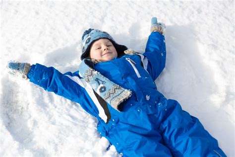 boy making snow angel  stock photo public domain pictures