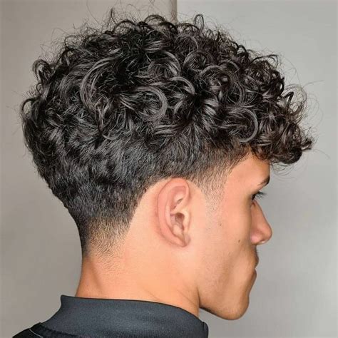 Curly low skin fade haircut for men | Taper fade haircut, Haircuts for ...