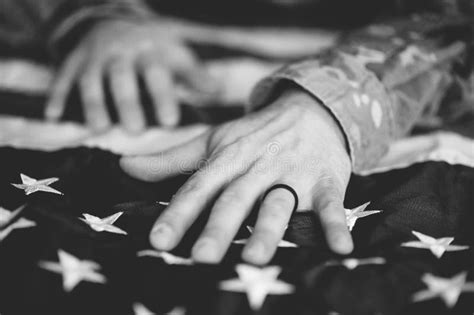 Greyscale Shot of an American Soldier Mourning and Praying with the ...