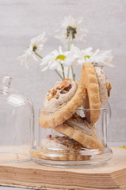 Free Photo | Oatmeal raisin cookies in glass jar.