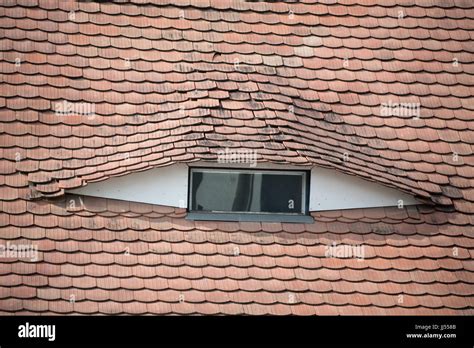 eye shaped window   tiled roofs  sibiu transylvania romania
