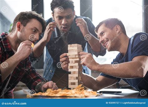 Jenga Game, A House Made Of Wooden Blocks On A Blue Background And ...
