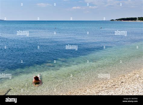 Fazana, Croatia, bathers on the beach of Fazana Stock Photo - Alamy