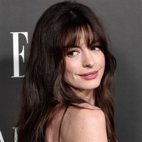 Anne Hathaway Just Wore a Corset Puffer Coat Over a Sexy Winter LBD—See