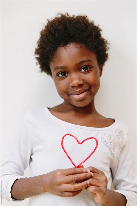 african american girl  big heart  valentines day  stocksy