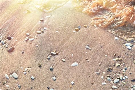 Sand Pebbles Beach and the Waves on Sea at Sunset or Dawn Stock Image ...