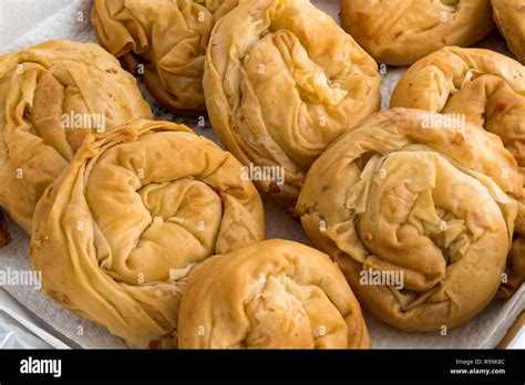 Baked homemade traditional Greek cheese pies Stock Photo - Alamy