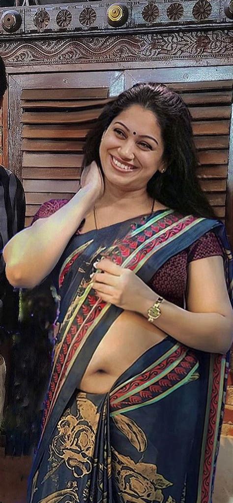 Beautiful mallu woman showing navel in satin saree - Best saree navel ...