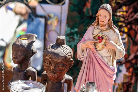 polytheism religion symbols, Christ and wooden African statues at ...