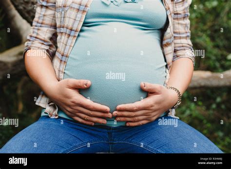 Pictures of the belly of pregnant women in nature with natural