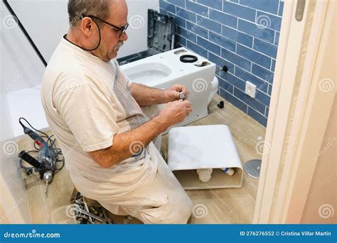 Installing Toilet Bowls In A Public Toilet. Installed Toilets Without ...