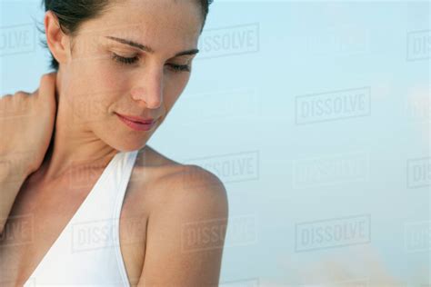 woman holding neck   portrait royalty  stock photo