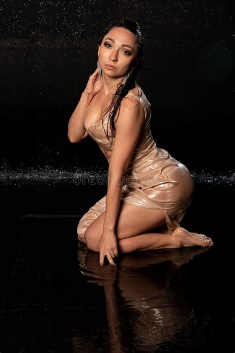 Beautiful Model in Aqua Photostudio, Wet Girl on Black Background