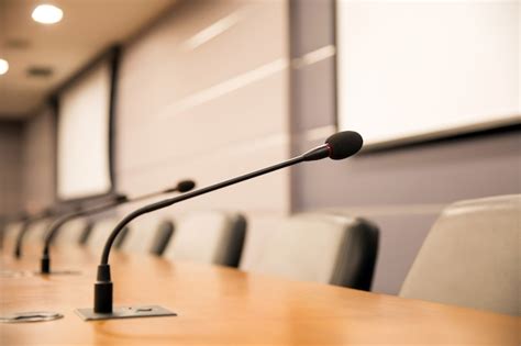 Premium Photo | Close up the conference microphone on the meeting table.