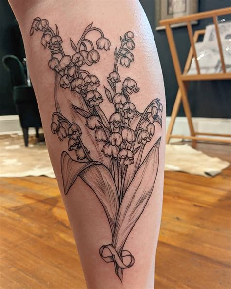 Realistic lily of the valley tattoo - Fiercetattoostudio.com