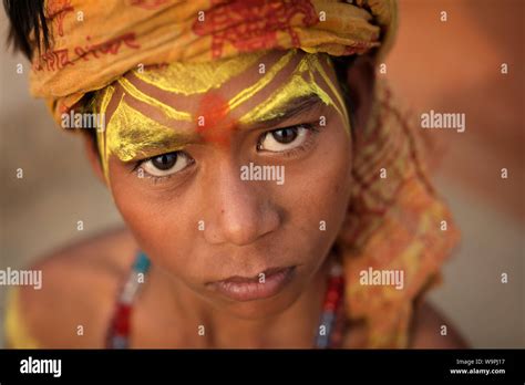 Young Sadhu boy on the ghats of Ganges in Varanasi, India. Varanasi is ...