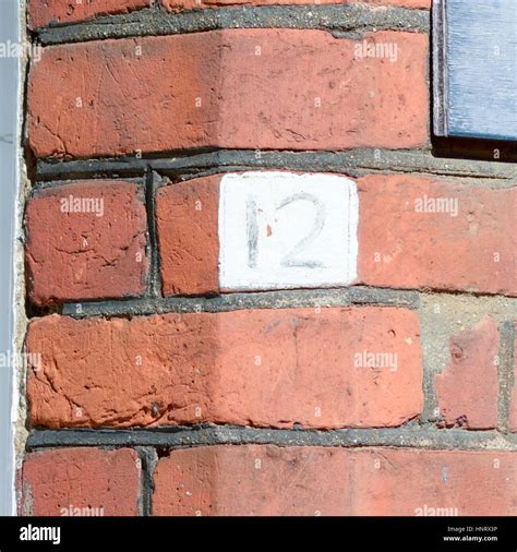 House number 12 sign on wall Stock Photo - Alamy