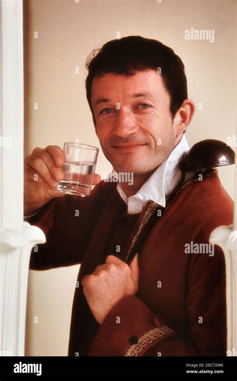 A period costumed dipper with a glass of iron-rich spa water from the ...