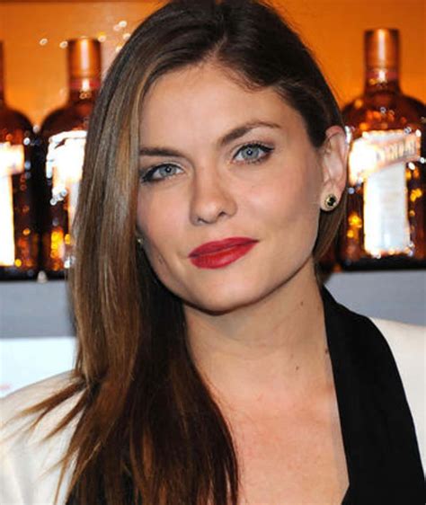 Download Jodi Lyn O'Keefe striking a pose in a stylish outfit Wallpaper