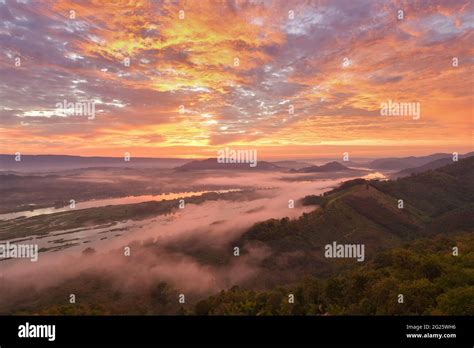 Aerial view of misty mountains at sunrise Stock Photo - Alamy