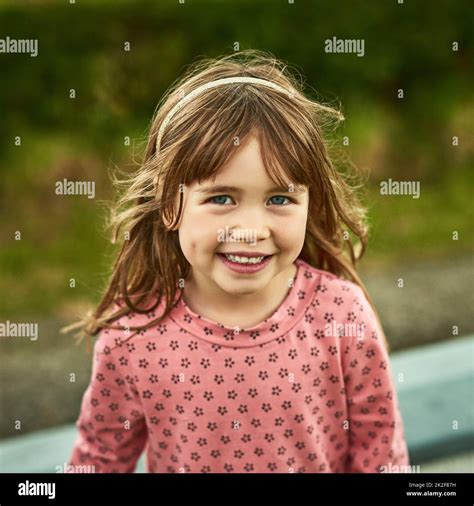 The world for kids are full of fun. Portrait of an adorable little girl ...