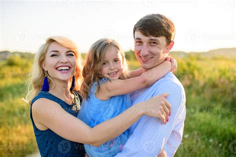Dad mom and daughter have fun together in nature. 7185006 Stock Photo