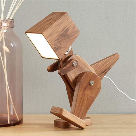 This Posable Wooden Dinosaur Lamp Is Perfect For A Dino Loving Kid's Room