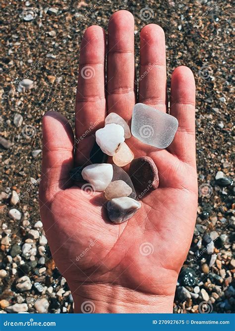 Top View of a Hand Holding Colorful Pebbles at Beach - Bodrum, Turkey