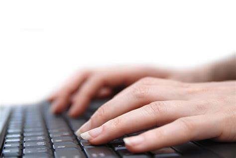 Isolated female hand typing on laptop keyboard 12124788 Stock Photo at