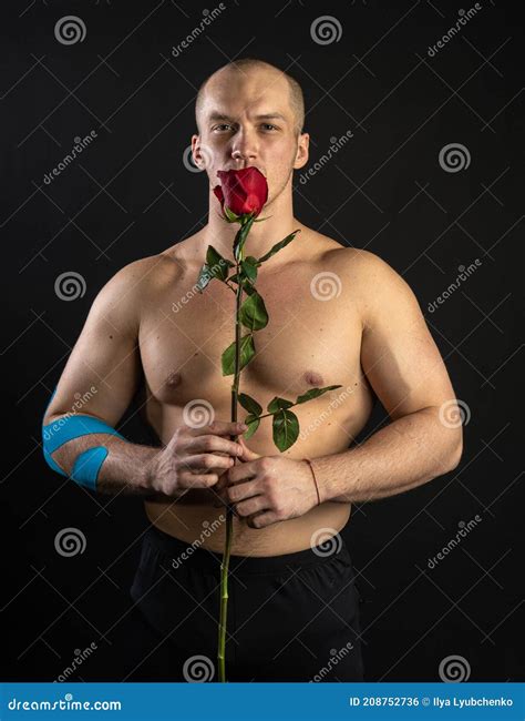 Athletic Man Holding a Red Rose, Naked for the Day of Velentin Pumped