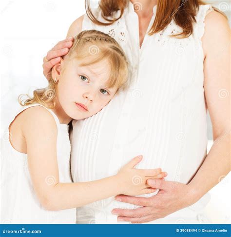 Girl Feeling Her Mother S Pregnant Belly. Stock Photo - Image of