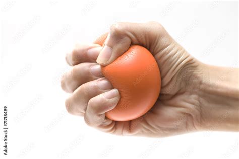 hand squeezing  stress ball stock photo adobe stock