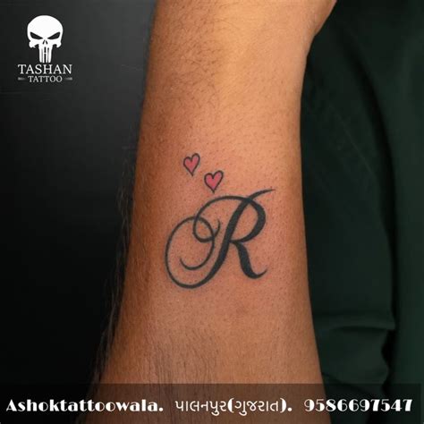 cursive letter  tattoo
