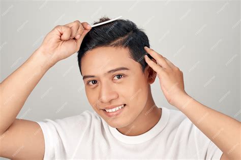 Premium Photo | Handsome smiling asian young man doing modern hairstyle