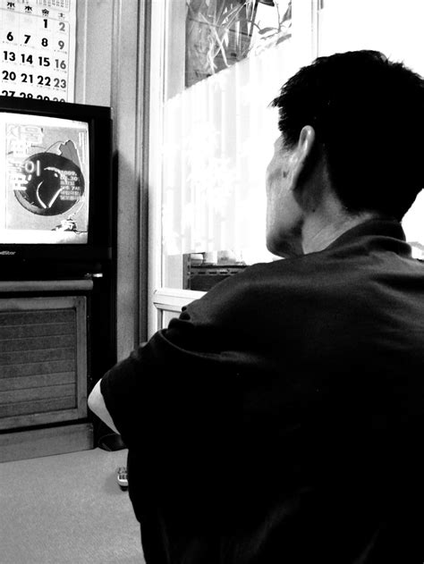 Man on floor watching tv | Smithsonian Photo Contest | Smithsonian Magazine