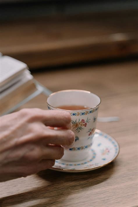 hand holding tea cup  stock photo